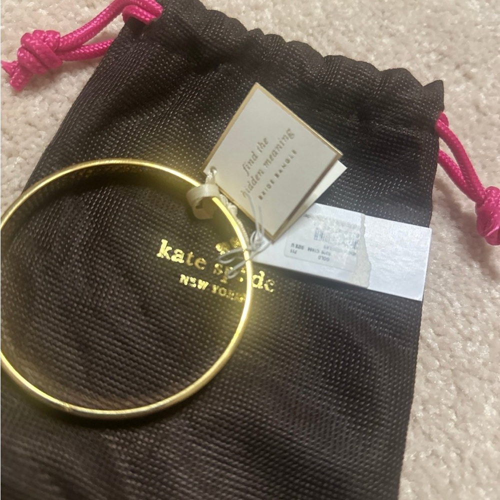 New Kate Spade “ Find the hidden meaning” Bride Bangle Gold tone
